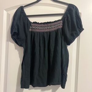 large madewell black top with pink embroidery
